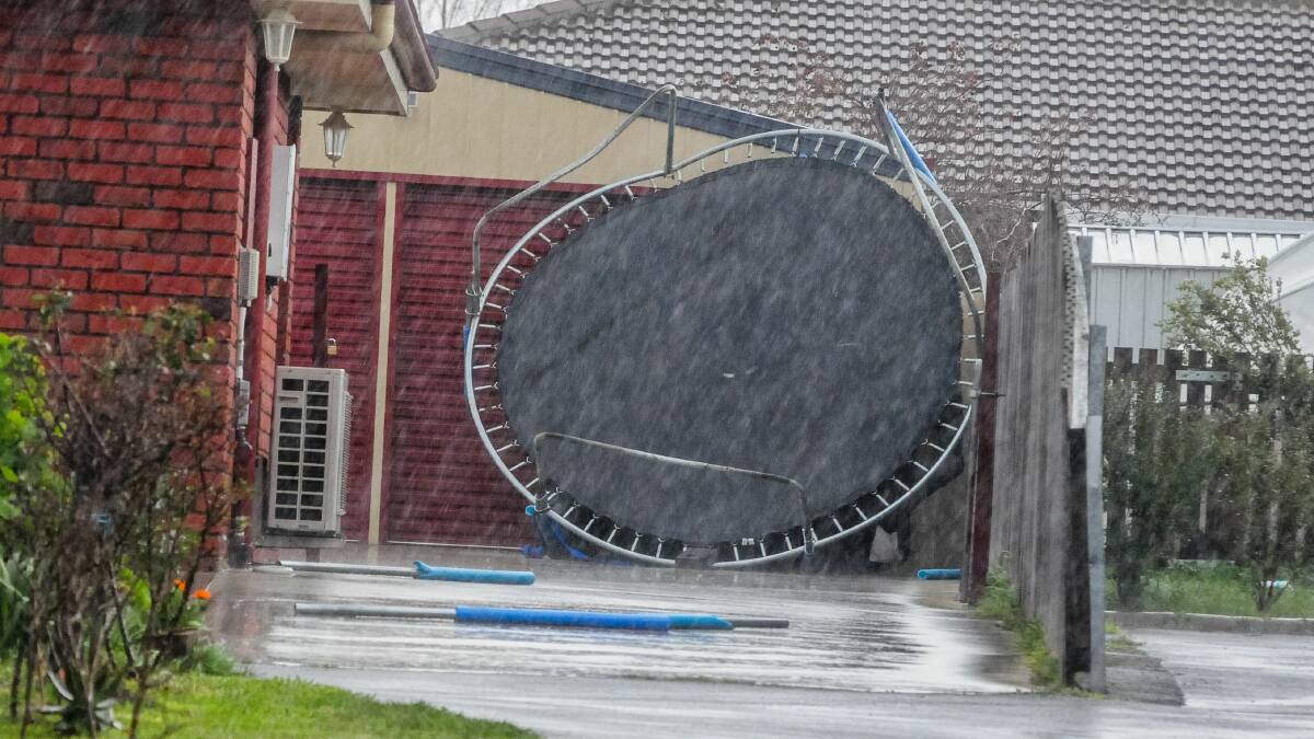 A trampoline blown away in the wind in 2018. The SES warns residents to secure their property ahead of damaging winds today. 
