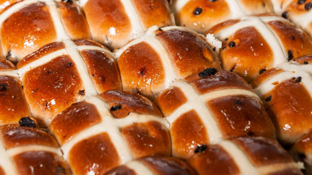 A fresh tray of hot cross buns ahead of Easter. Picture: Phillip Biggs