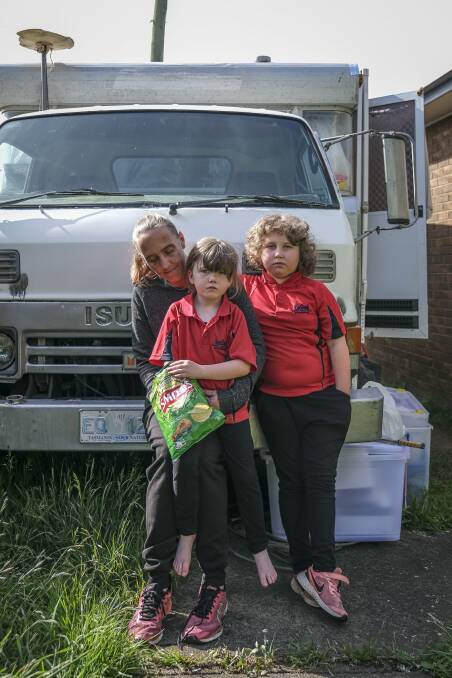 Stacey Lodge with daughters Scarlett Foon and Kendyl Towns outside their campervan. Picture: Craig George
