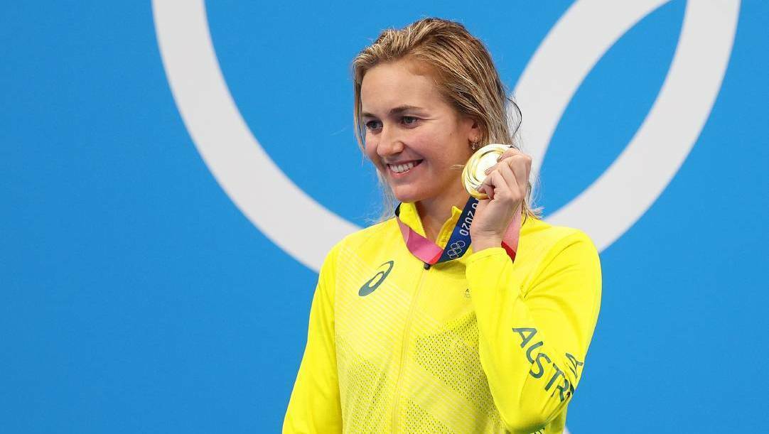 Ariarne Titmus holding her gold medal at the Olympics. Picture: AAP 