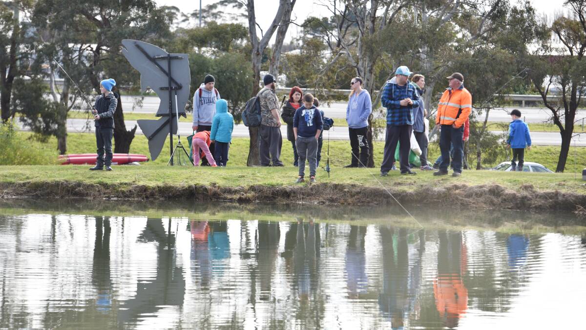 GETTING HOOKED: Anglers start to choose their spots  at Frombergs Dam, near Ulverstone, during the opening weekend of the trout fishing season in 2016. Picture: Brodie Weeding.