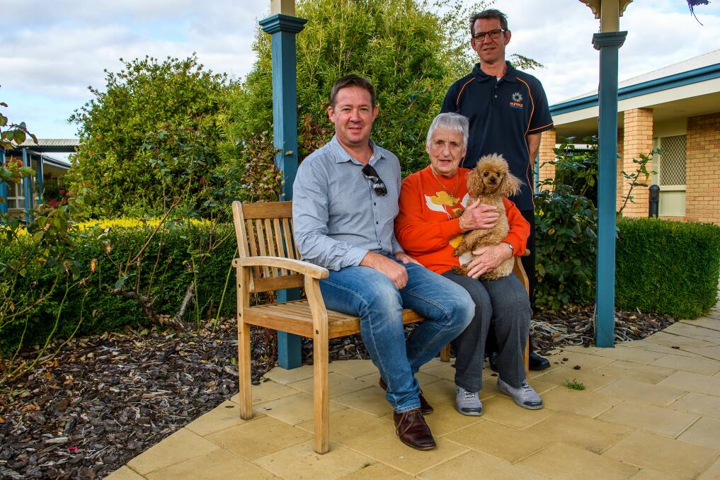 EUREKA: Eureka Group operations manager Andrew Heyer, Launceston Gardens resident Patricia McCarthy, her dog Zac and village manager Matthew Deans. Picture: Scott Gelston