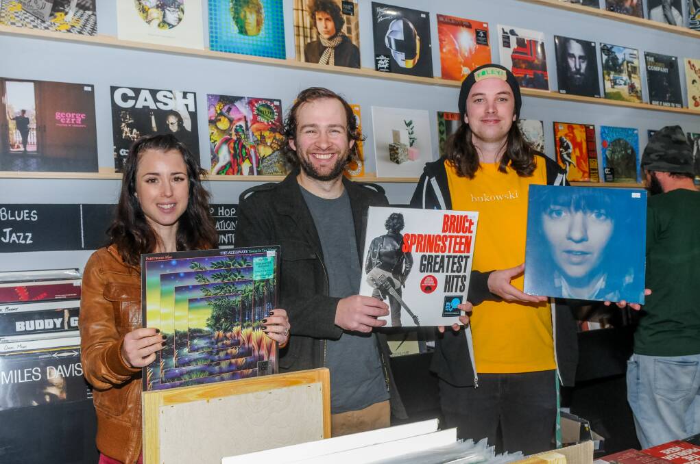 Avenue Records staff member Hannah Nobes, owner Callum Nobes and staff member Pat Broxton with a few classic vinyls. Picture: Neil Richardson