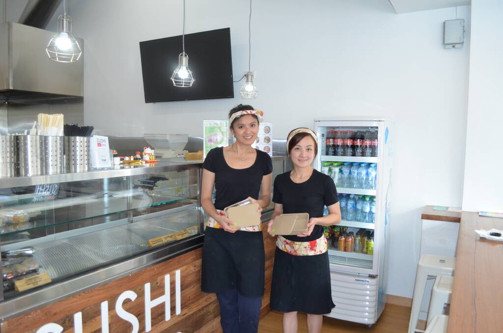 LUNCHBOX: Sushi Plus on George staff member Maybelline Chang and manager Krista Long model the new reusable boxes. Picture: Stefan Boscia