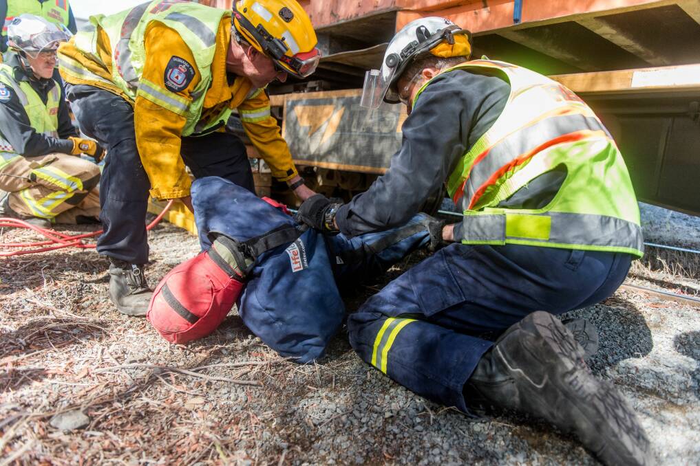 The training simulated someone getting stuck under a train. Pictures: Neil Richardson