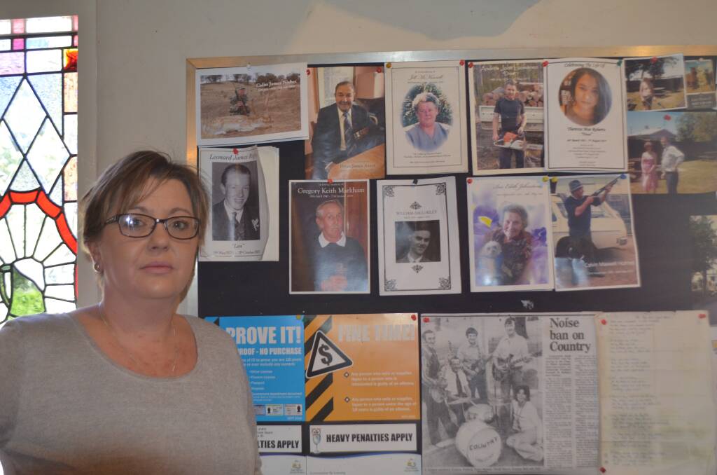 COMMEMORATION: Pub co-owner Tamara Frankcombe with the memorial wall. Picture: Stefan Boscia