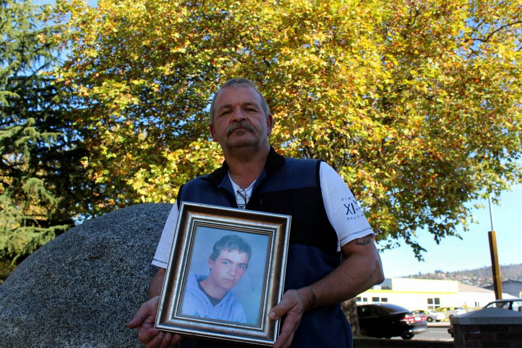 WORKERS: Guy Hudson holds a picture of his deceased son Matthew. He will commemorate his death on Saturday. Picture: Hamish Geale