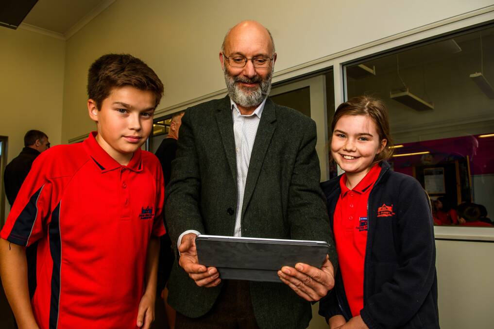 NBN: invermay Primary pupil William Crawford, NBN Co's Russell Kelly and pupil Edie Burns. Picture: Scott Gelston
