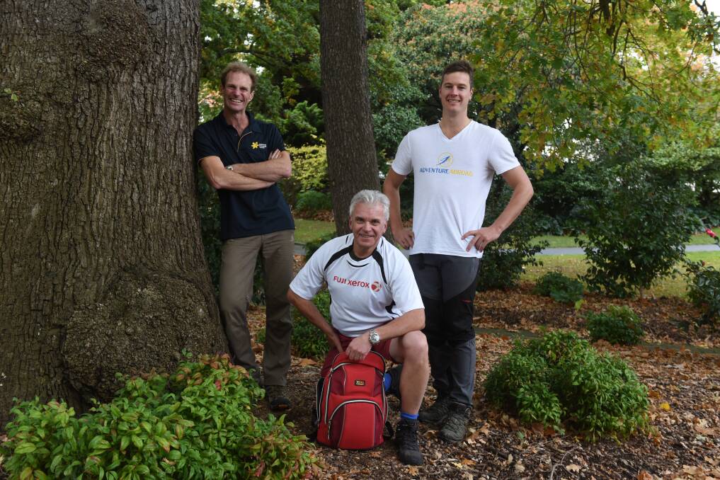 KOKODA: Cancer Council Tasmania state project manager for marketing Anthony Edwards, Paul Fallon and Adventure Abroad's Tom Allwright. Picture: Paul Scambler
