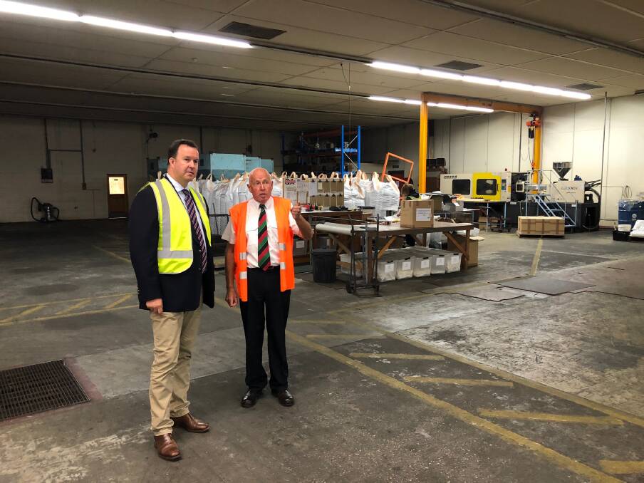 SOFT PLASTIC: Tasmanian Liberal senator David Bushby with international director of Envorinex Mike Turner at the George Town plant. Picture: Supplied