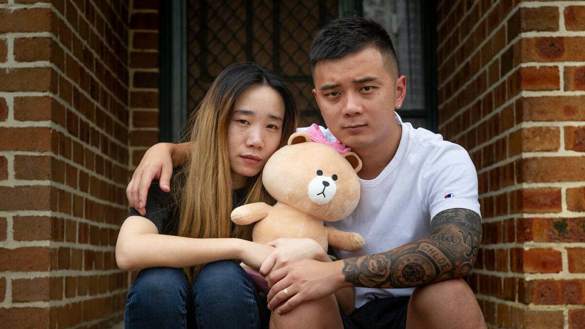 Yi Zhao and Yufei Luo hold one of their daughter Chloe Luo's toys. They want to be reunited with her after she became stranded in Hubei province. Picture: Elesa Kurtz