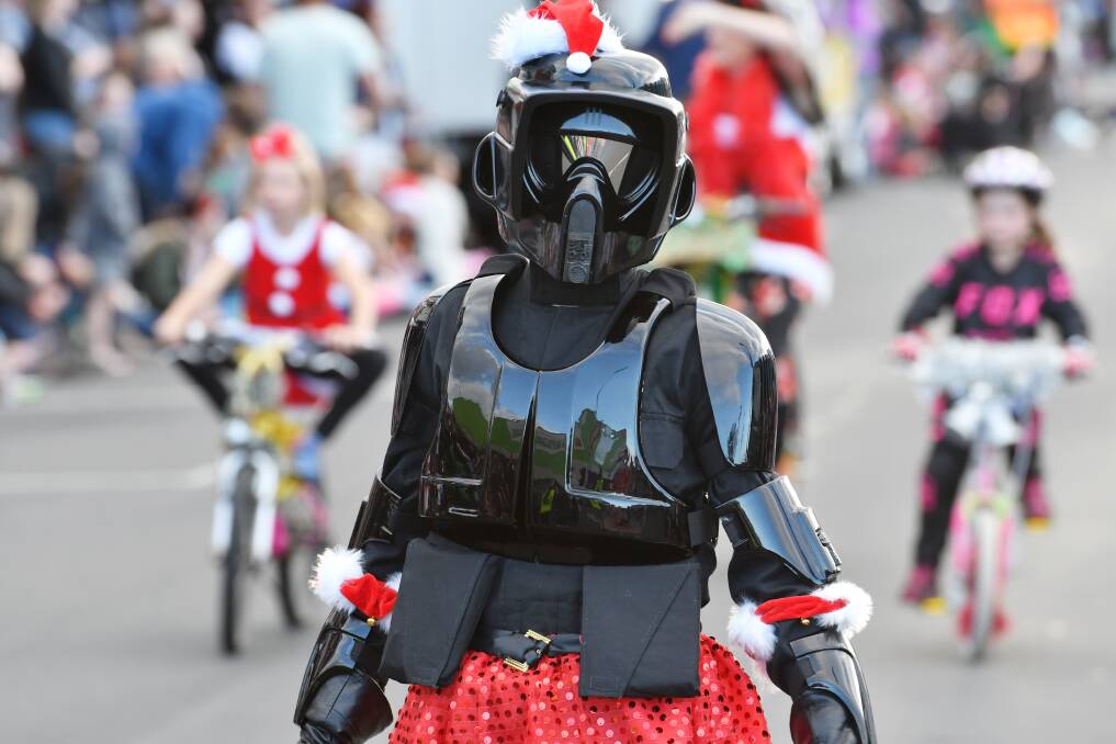 COMING TOGETHER: Christmas parades attract all sorts - including a festive Star Wars character - in a spirit of belonging. Picture: File