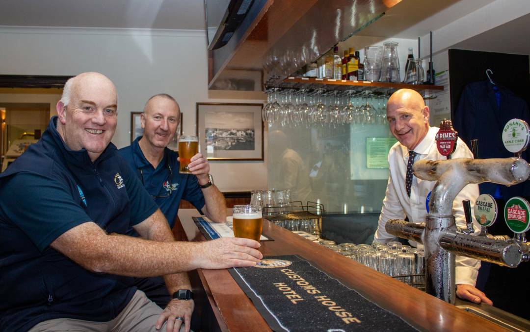 CHEERS: Tasmanian Hospitality Association chief executive Steve Old and president Paul Jubb with Premier Peter Gutwein earlier this month. Picture: Supplied