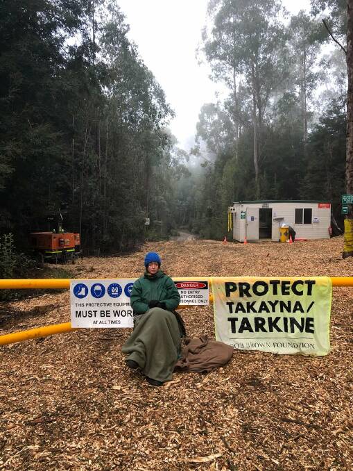 BLOCKED: A protester chained to a gate at the site of a proposed new tailings dam for the Rosebery mine. Picture: Bob Brown Foundation