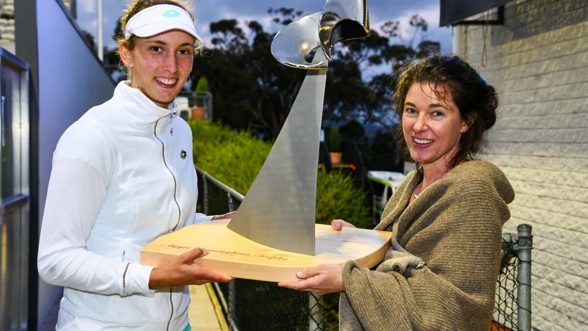 REMEMBERING ANGIE: Hobart International Women's Singles champion Elise Mertens  and Launceston-based designer Anita Dineen with the inaugural Angie Cunningham trophy. Picture: Alistair Bett.