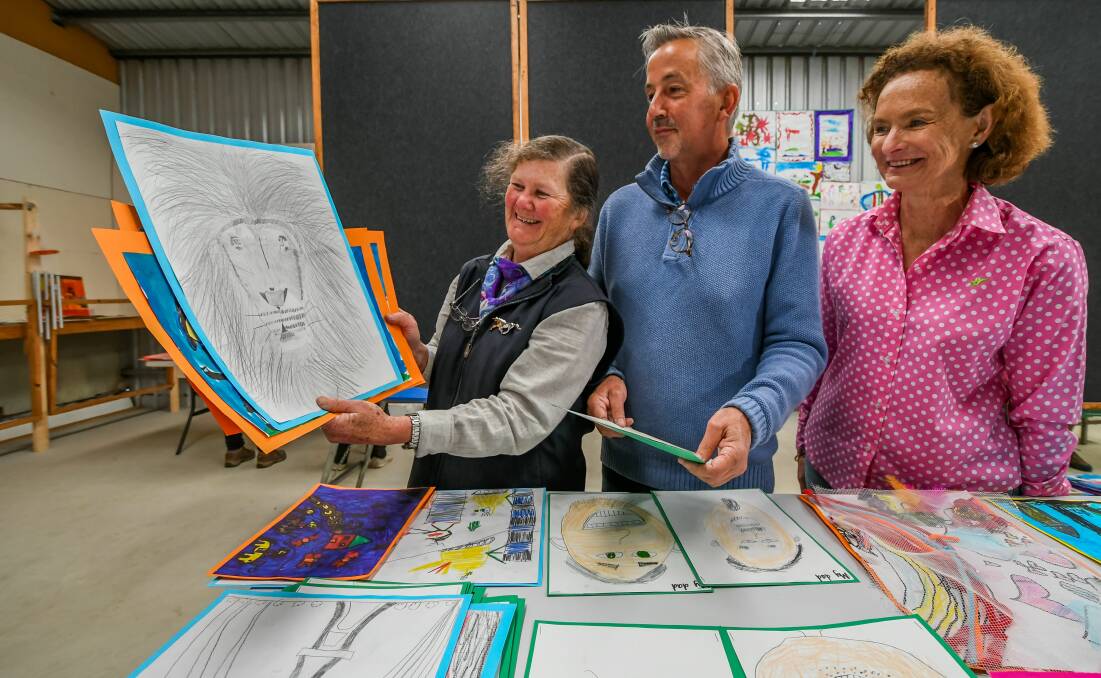SHOW AND TELL: Nana Catmur, Michael McWilliams and Ros Propsting judge the school art competition at the Longford Show on Friday. Picture: Phillip Biggs.