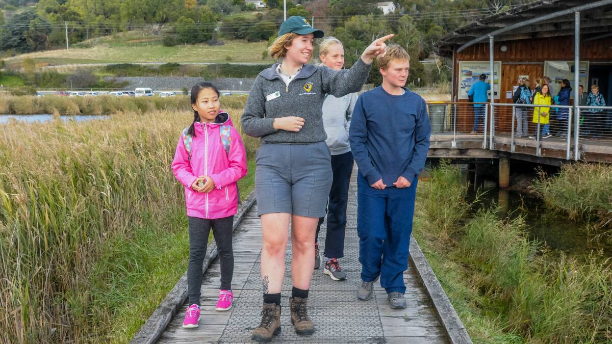 NATURAL WONDER: Rui Han, discovery ranger Emma Dale, Rebecca Clarke, 11, and Jonathan Clake, 15 Picture: Neil Richardson 