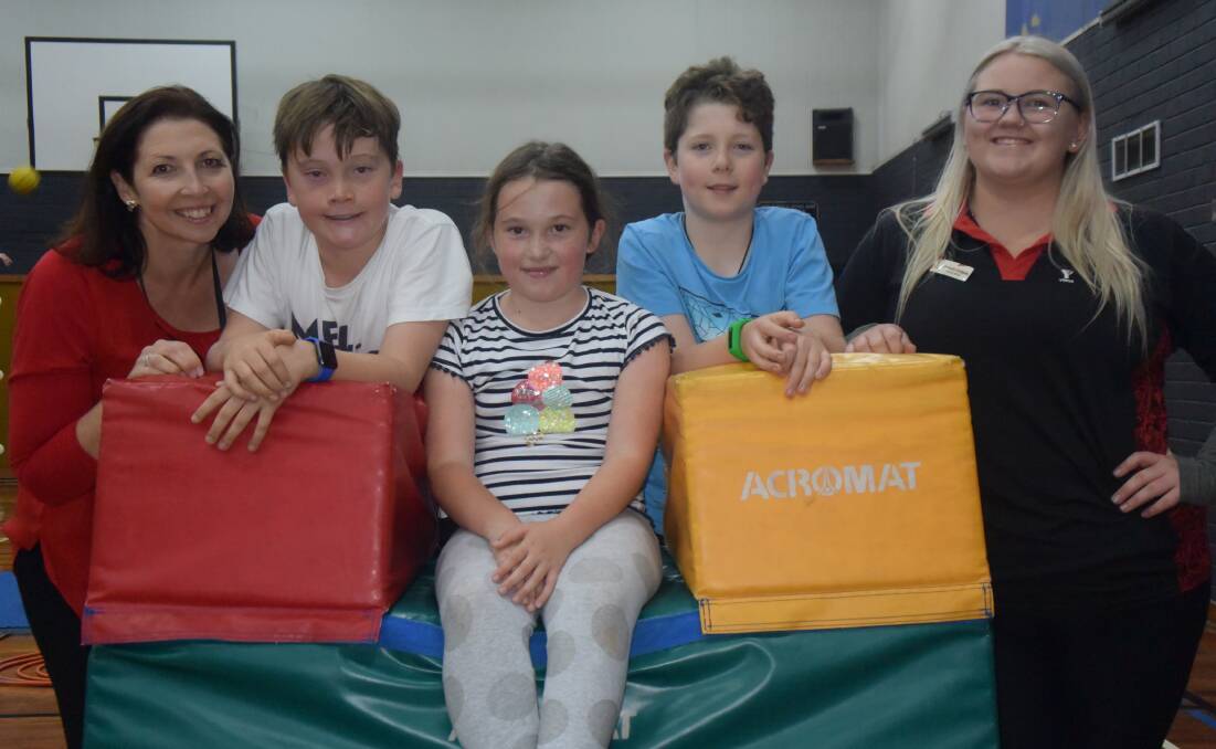 TASTE TEST: Li-Ve project manager Anna Holliday (left) and Chantelle Hodgetts (right) with Sam, Sienna and Thomas at the YMCA on Saturday.