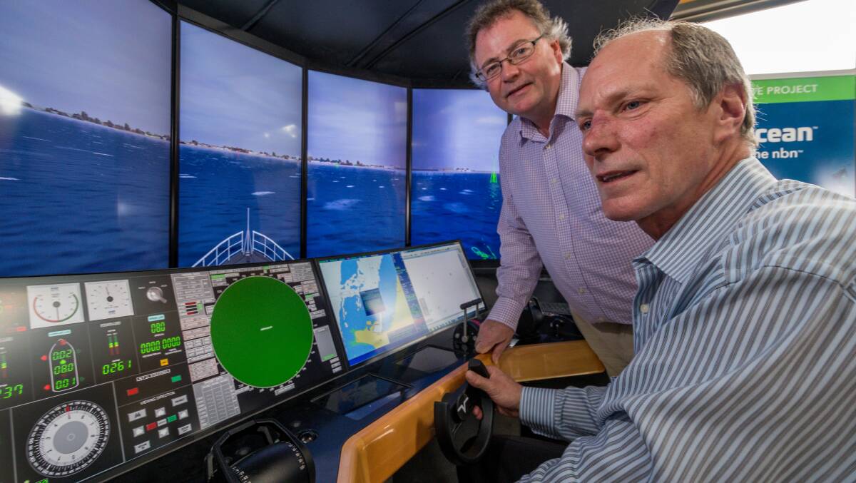 Pivot Maritime International director Jeffrey Hawkins (closest to camera) and Launtel chief technical officer Damien Ivereigh. Picture: Phillip Biggs