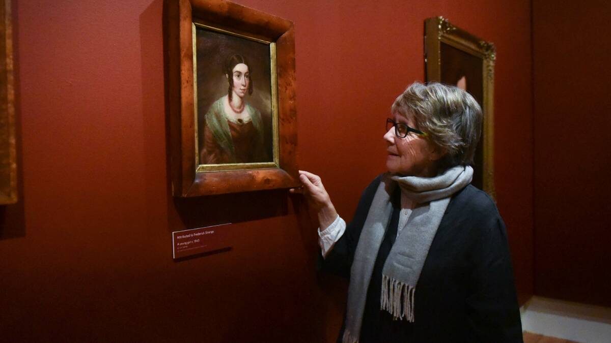 FREDERICK FAN: Queen Victoria Museum and Art Gallery guest curator Yvonne Adkins with artwork by Frederick Strange. Picture: Neil Richardson.