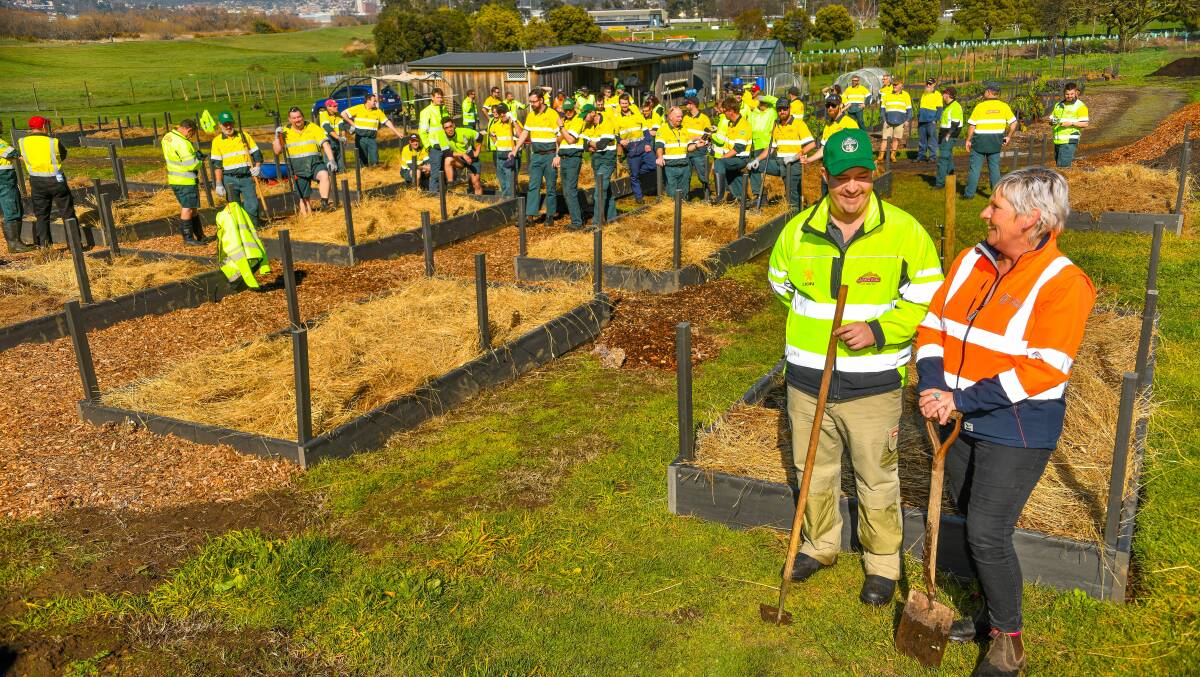 COMMUNITY SUPPORT: Boag's site manager Nathan Calman and Youth Future's Charlotte Blank with the Boag's workforce. Picture: Scott Gelston