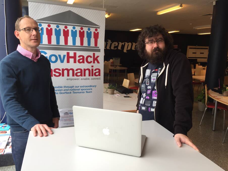 THE HACK IS BACK: GovHack state director Damian Frappell with James Riggall. Picture: Sean Slatter
