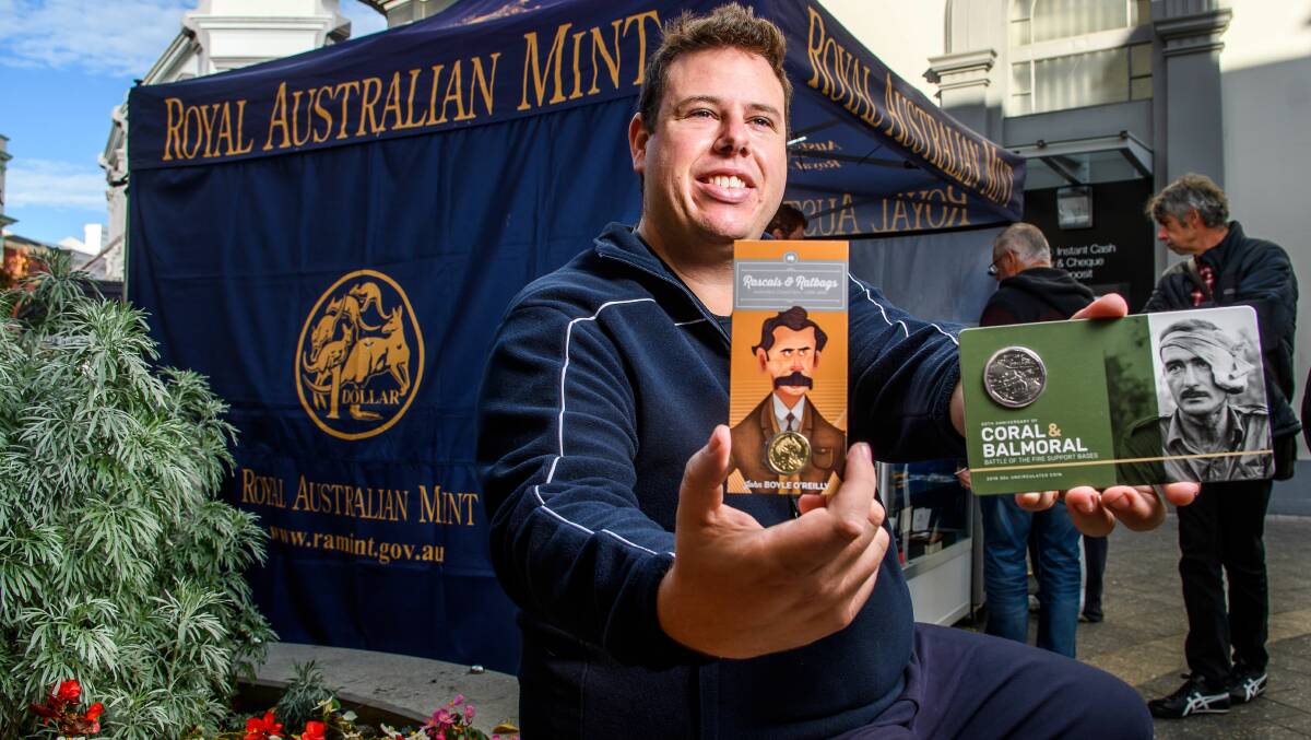 COIN CALLING: The Royal Australian Mint's Ross Williamson with some of the collectable coins in the Quadrant Mall. Picture: Scott Gelston 
