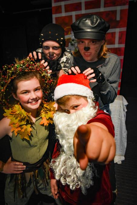 STAGE STARS: Edie Burns as Peter Pan and Angus Richardson as Santa, with Jed Hodgman and Jess Mahnken. Picture: Paul Scambler