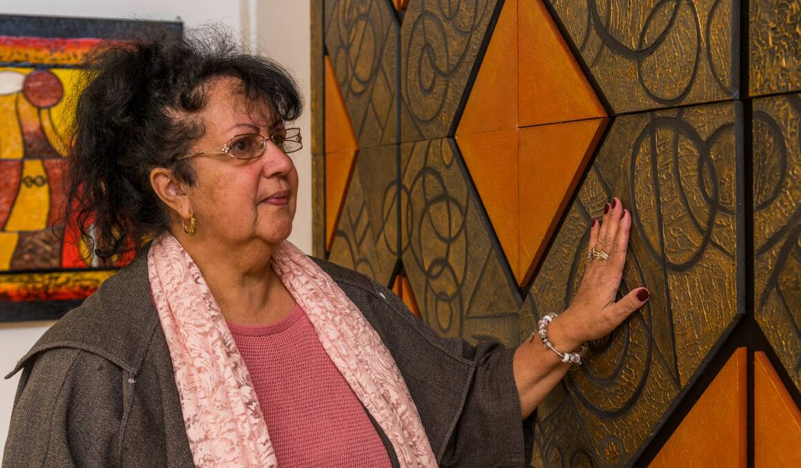 PROUD: Aboriginal Elder and artist Judith-Rose Thomas, with one of her petroglyph pieces. Pictures: Phillip Biggs 
