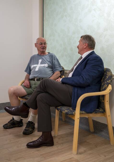 Northern Cancer Service Director Dr Stan Gauden with a patient in one of the refurbished waiting areas. .