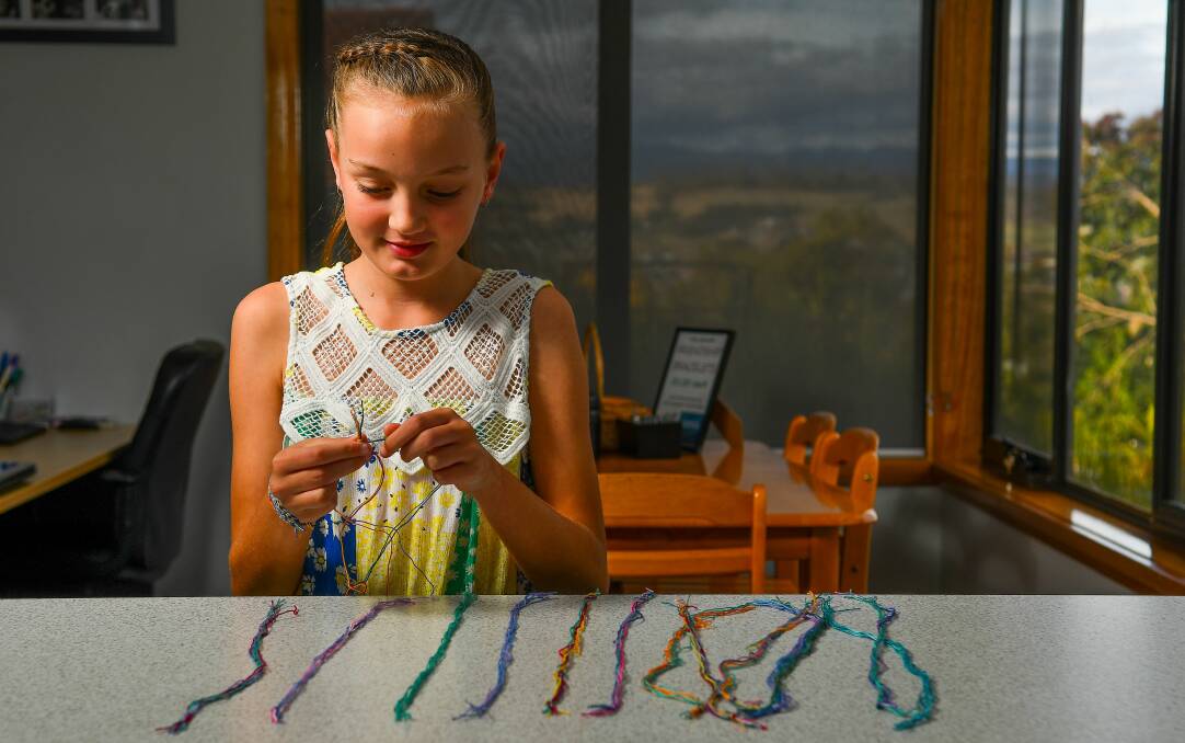 GOOD CAUSE: Chloe Payne, 11, has made more than 100 bracelets to help Rally for Rhys - a charity set up in honour of two-year-old Rhys Hodgetts who died suddenly in 2016. Picture: Scott Gelston 