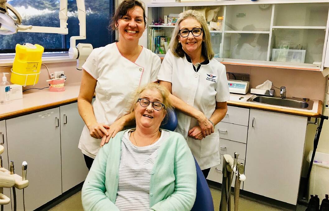CARE: RFDS Tasmania dentist Lorika Strickland and dental assistant Maureen Hamilton with their first patient on King Island, Leanne Geary.