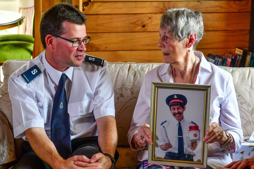 CONCERN: Salvation Army Auxiliary Lieutenant Roderick Brown with Eva Mehegan, holding a photo of her 59-year-old son Mark Schwamm. Picture: Scott Gelston 
