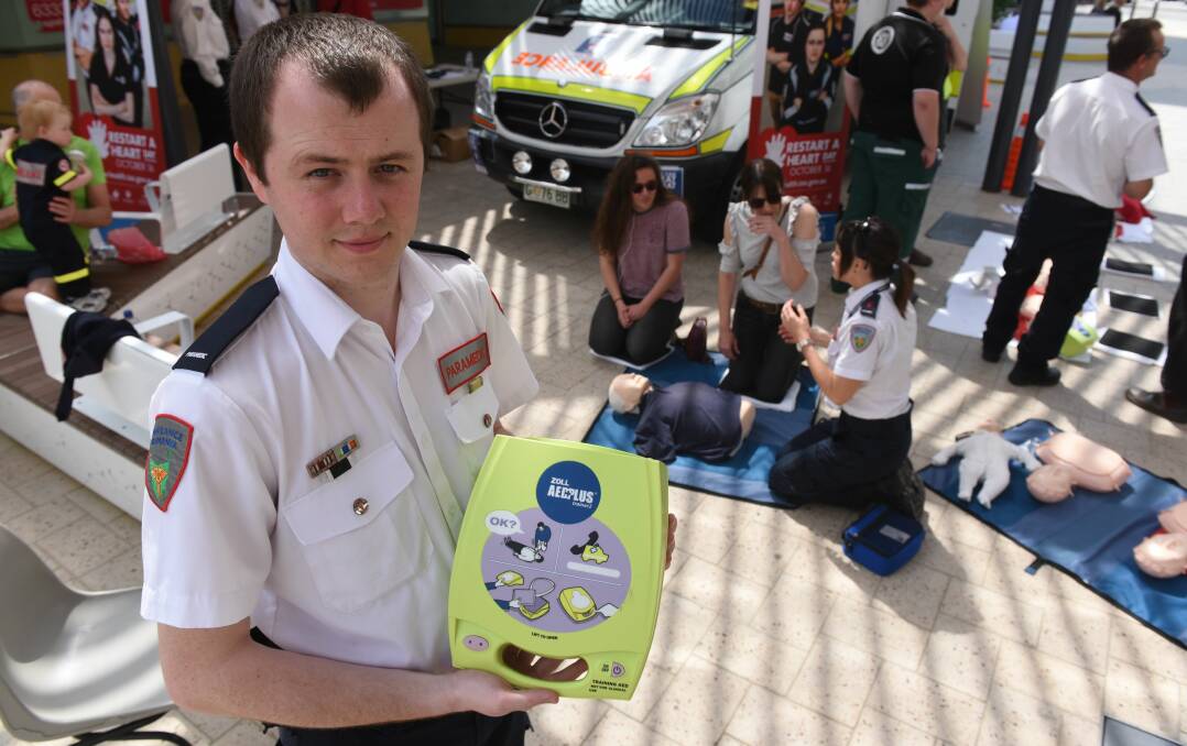 IMPORTANT: Ambulance Tasmania paramedic intern Corey Armstrong at Tuesday's Restart a Heart Day event at Brisbane Street Mall. Picture: Paul Scambler  