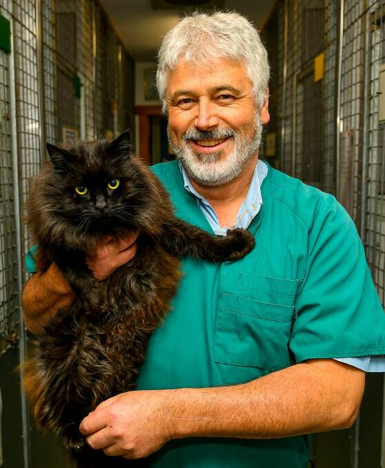Dr Andrew Byrne and Fritz the cat. Picture: Scott Gelston 