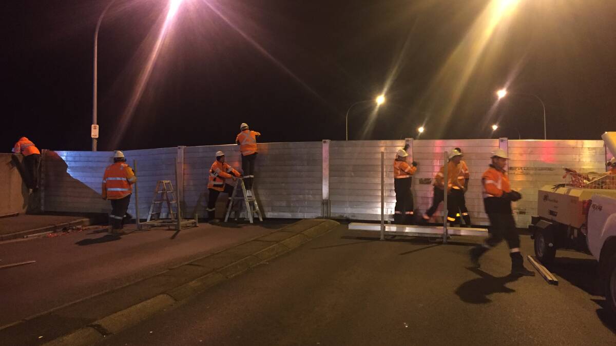 Charles Street bridge was closed for two hours on Tuesday night at council workers assembled the bridge’s floodgate system. Picture: Jessica Willard 