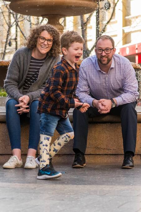 BRAVE: Three-year-old Arthur Long tests out his new 'leggies', with mother Carly and Foundation33inc president Grayson Genders. Picture: Phillip Biggs 