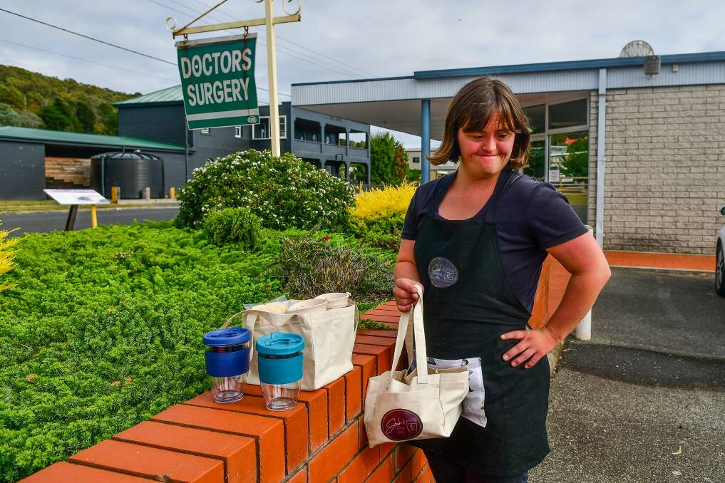 To celebrate World Down Syndrome Day, Sarah Squires has gifted reusable coffee cups to her regular clients in Beaconsfield and Beauty Point. Picture: Scott Gelston 