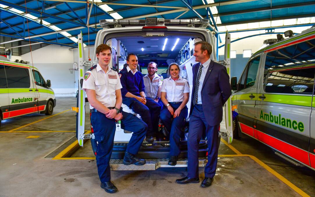 RECRUITS: New Ambulance Tasmania paramedics Alister Cole, Ben McLean, Mat Holt and Caitlin Beaumont, with Health Minister Michael Ferguson. Picture: Scott Gelston