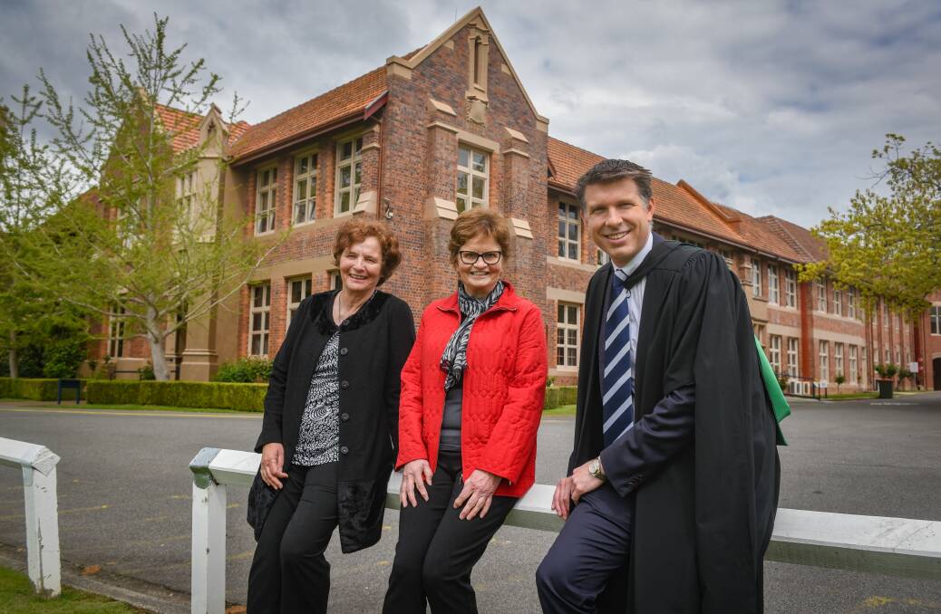 Proud: Professor Elizabeth Blackburn's sisters Barbara Loh and Katherine Marsden, with Launceston Grammar headmaster Richard Ford. Picture: Paul Scambler 