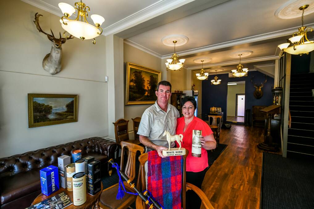 EXCITED: Kent Fisher and Natalie Bell's whisky bar and bagpipe museum The Grumpy Piper will open its doors on Friday afternoon. Picture: Phillip Biggs 
