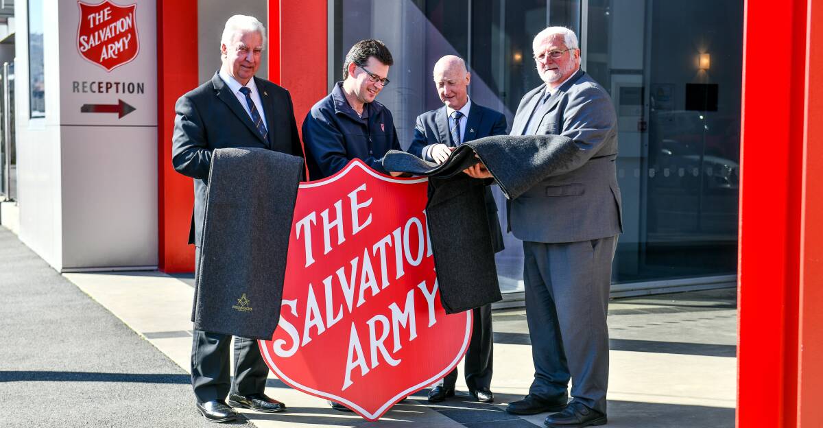 DONATION: Freemasonry Tasmania grand master John Slore, with the Salvation Army's Roderick Brown, and Freemasons Phillip Oddie and David Loone. Picture: Scott Gelston
