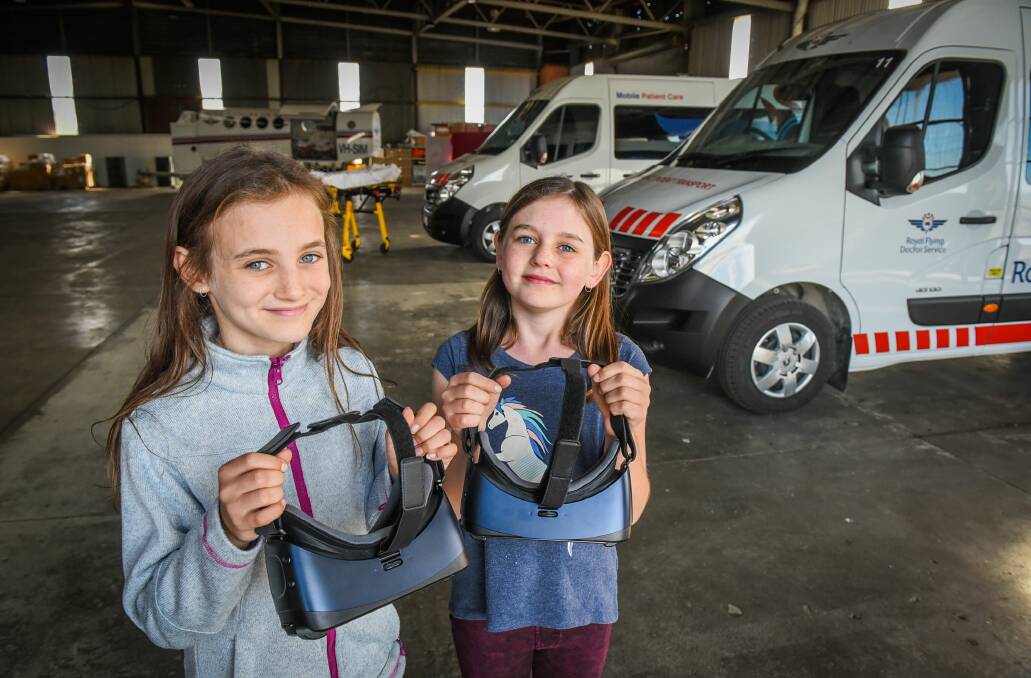 EXCITED: Indiana Carman,11, and Zoe Carman,10, test equipment ahead of Sunday's Royal Flying Doctor Service open day. Picture: Paul Scambler 