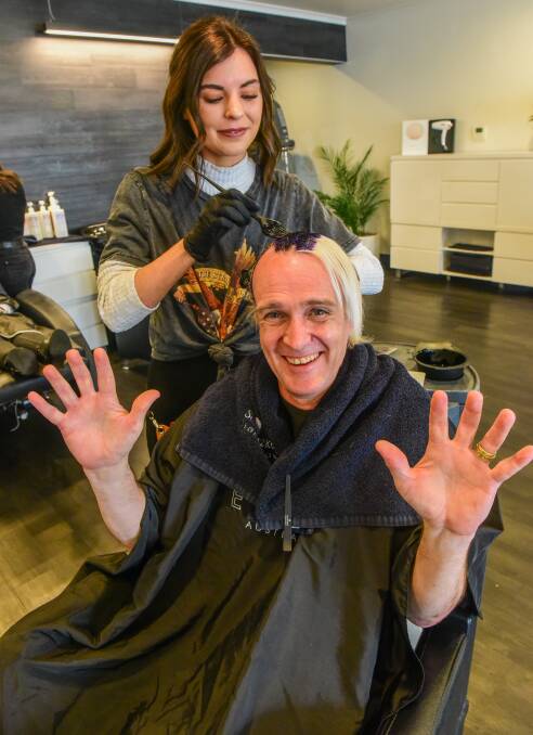 VISION: Brendan Vote has dyed his hair blue to raise funds for Australia's first dedicated ophthalmic gene therapy centre, with help from Sass Hair's Chloe Jenkins. Picture: Paul Scambler 