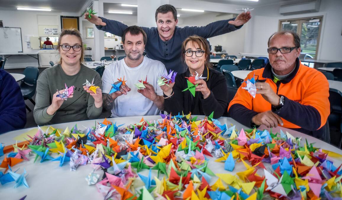 CAUSE: Missiondale's Natasha Clayden, Jarrett Gregson, Debbie Down, Asko Valkama and Matthew Blackwell (back), with some of the origami made for the 1000 Cranes Project. Picture: Neil Richardson