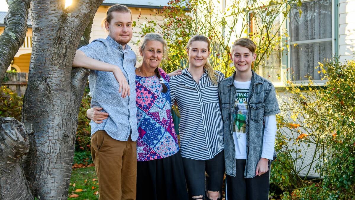 REUNITED: Joe Johnston with mother Jenny, sister Grace and brother Will. Picture: Scott Gelston 