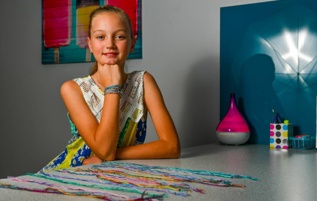 HELP: Chloe Payne, 11, of Norwood, has been busy making bracelets for people living with grief all over the world. Picture: Scott Gelston 
