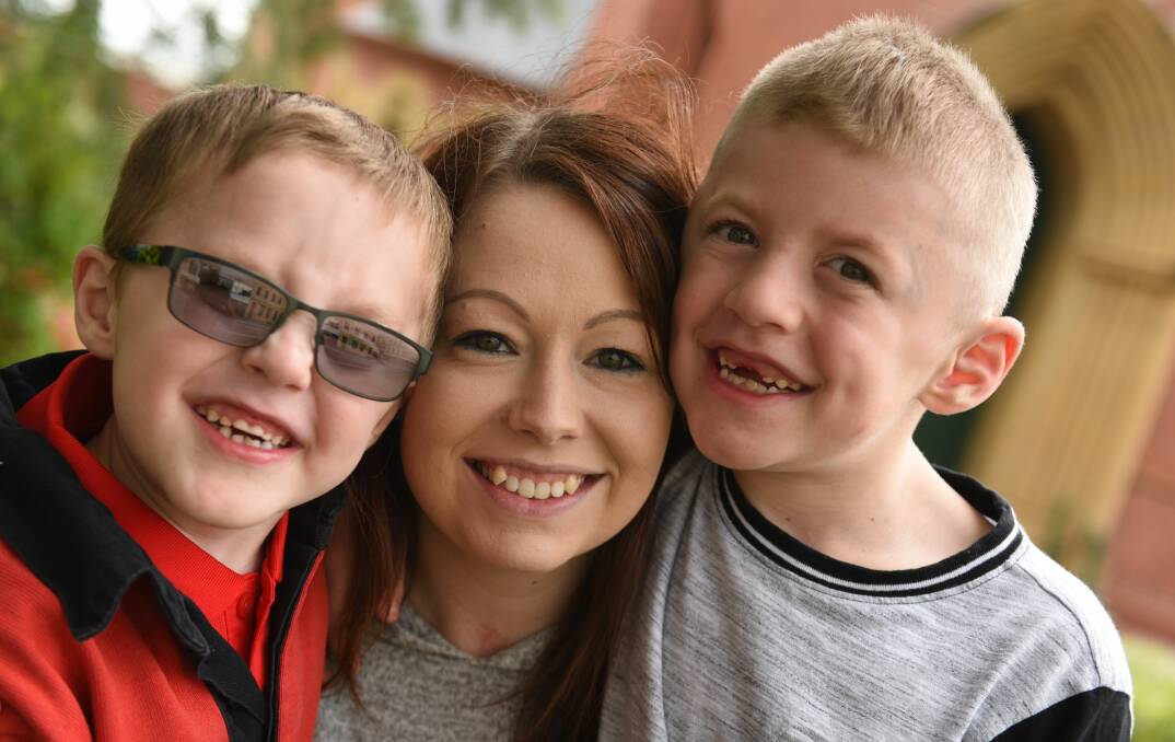 Brothers Rileigh, 4, and Brayden Richardson, 7, with mother Toni Ford. Pictures: Paul Scambler