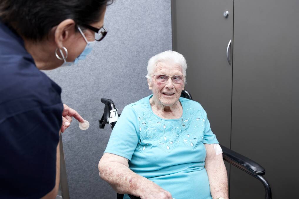 Uniting AgeWell Newnham Community Aldersgate Village resident Margaret Young was the first of 72 residents to receive their COVID-19 vaccination on Monday. Picture: Supplied/Dave Groves