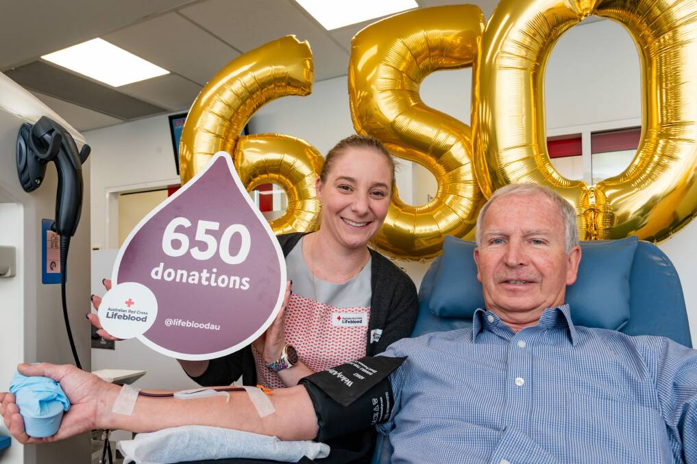 HERO: Launceston Blood Donor Centre session leader Abbey Waller with Graeme Goddard, who made his 650th donation on Friday. Picture: Phillip Biggs 